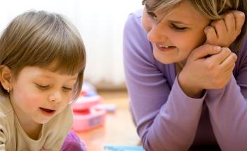 preschool child talking with mother